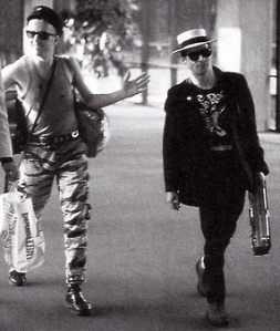 Bernard Rhodes and Joe Strummer - La Guardia airport Oct, 1982.
